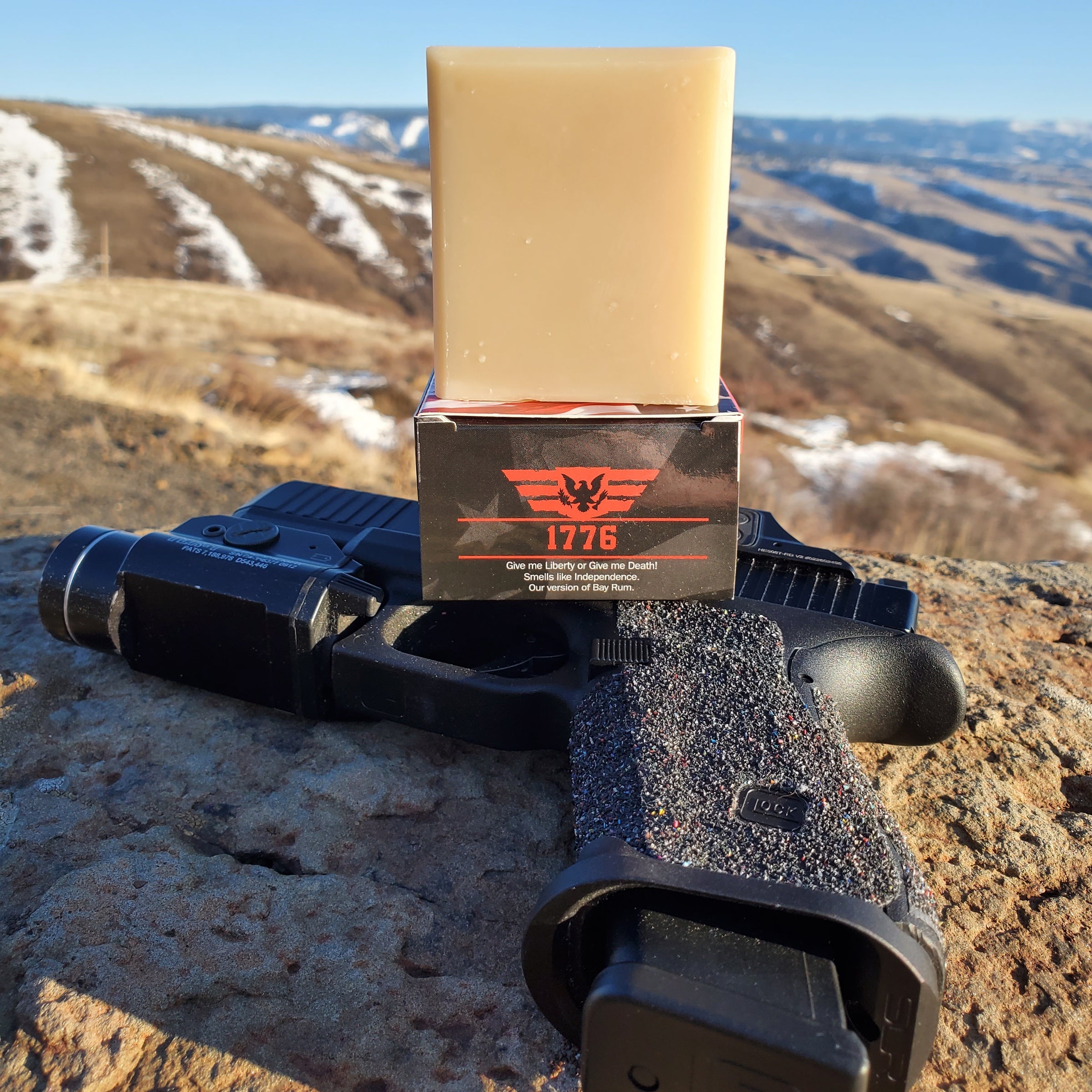 1776 Patriot And Company Natural Handmade Men's Soap Bay Rum overlooking Riggins, Idaho with gun