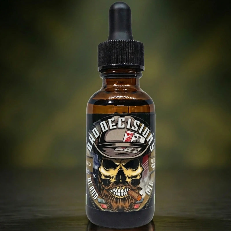 Bad Decisions Beard Oil by Patriot Beard Co. Label shows a skull with a fedora, playing cards, and a cigar. Scented with notes of rich tobacco and bourbon, designed for the man who lives by his own rules.