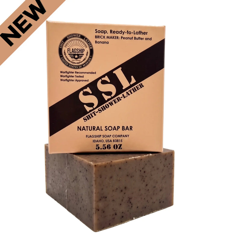 Flagship Soap Company "Brick Maker" natural bar soap (5.56 OZ), angled view. This massive, medium-grit bar smells exactly like MRE Peanut Butter and Banana. Box details include: "Soap, Ready-to-Lather," "Warfighter Recommended," and the "Flagship Idaho, USA" crest. Perfect for deep-cleansing.  New Release