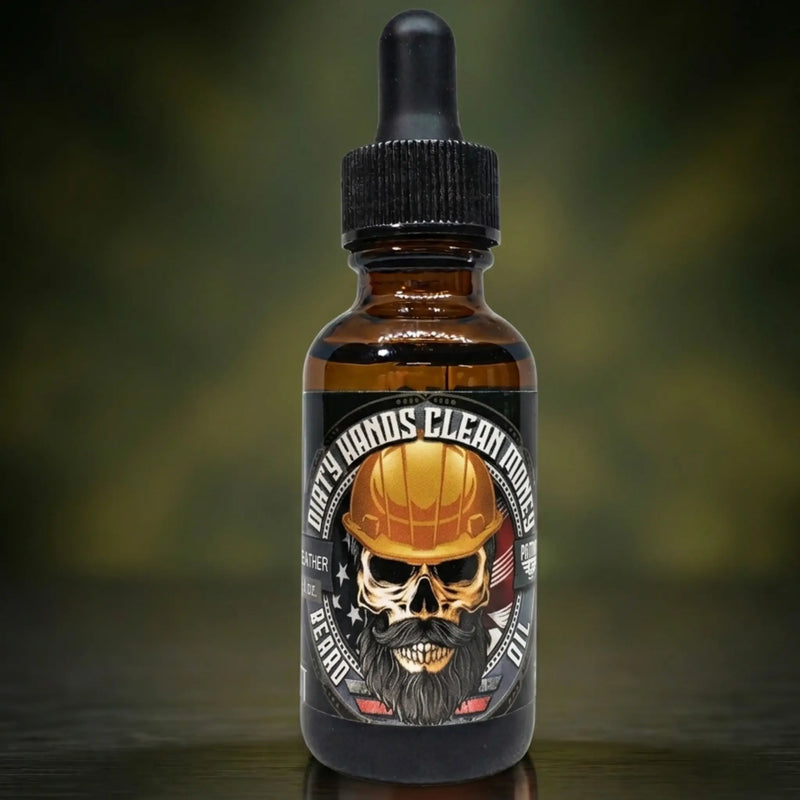 Dirty Hands Clean Money Beard Oil dedicated to the blue-collar worker. Label features a bearded skull in a yellow hard hat. A heavy-duty Leather scented oil designed for tradesmen and hard workers.