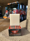 Hose Dragger natural men's soap for firefighters by Patriot and Company soap and soap box firetruck and lights in background